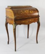 A French rosewood and marquetry inlaid cylinder bureau, with fitted interior, on gilt brass