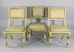 A set of three Continental neo-classical cream painted and parcel gilt side chairs, with patterned