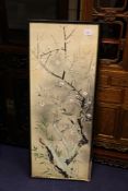 A Chinese/Japanese watercolour on silk, of a bird perched amongst prunus and bamboo, 42.5 x 16.