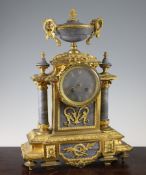 A 19th century French ormolu and grey marble mantel clock, of architectural form, unsigned movement,