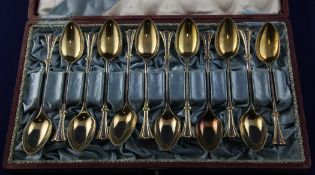 A cased set of twelve late 19th/early 20th century Russian 84 zolotnik parcel gilt silver coffee