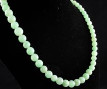 A single strand graduated jadeite bead necklace, 25.5in.