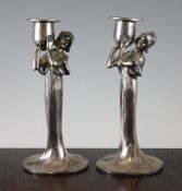 A pair of Juventa silvered pewter figural candlesticks, stamped mark 53 to base, 8.5in.