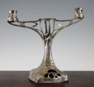 A stylish Continental Art Nouveau two branch candelabra, with whiplash tendrils, flowerhead and