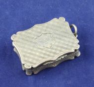 An early Victorian silver vinaigrette, by Nathaniel Mills, of shaped rectangular form, with