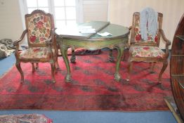 An Afghan carpet, with field of twenty one octagons on a red ground, with multi row border, 10ft