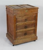 A Roberson & Co oak artist`s cabinet, the double hinged top opening to reveal a zinc lined