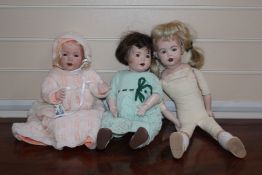 A J.D. Kestner bisque headed doll, no.237, with soft body and part bisque arms and legs