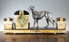 A French Art Deco mantel clock, mounted with a silver model of a hound, the lozenge gilded dial