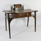 George Montague Ellwood for J.S. Henry. An Art Nouveau mahogany writing table, the top with inset