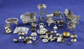 A quantity of early 20th century and later, continental and English silver miniature furniture,
