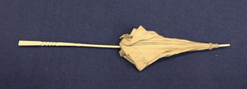 A Victorian carved ivory and silk parasol, with twisted handle, 38in.