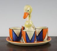 A Clarice Cliff Geometric pattern duck stand and four egg cups, the stand with printed Bizarre