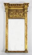 A Regency gilt pier glass, with applied ball decoration, a cherub frieze with cluster column and
