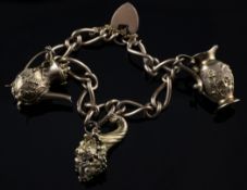 A 9ct gold chain link charm bracelet, with heart shaped padlock and hung with three charms, gross