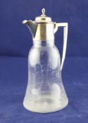 A late Victorian silver mounted bell shaped glass claret jug, with turned finial and angular handle,