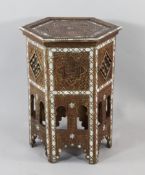 A North African Islamic mother of pearl and bone inlaid hexagonal occasional table, with pierced