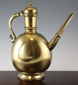 A large 18th century Mogul brass ewer, with bird and beast handle, 15in.