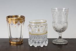 A Moser glass beaker, a Bohemian glass goblet and a Russian glass vase, the Moser octagonal tapering