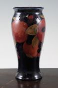 A Moorcroft `Pomegranate` baluster vase, c.1925, on cobalt blue ground, inscribed `W Moorcroft`