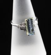 A platinum, yellow gold, aquamarine and diamond set dress ring, with rectangular stone and diamond