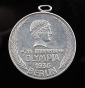 A 1936 Berlin Olympiad silver medallion, with later suspension ring