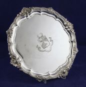 A late Victorian silver salver, of shaped circular form, with shell and gadrooned border and