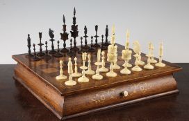 A late 19th / early 20th century carved bone and carved stained wood Indian chess set, together with