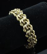 A 15ct gold chain and disc link bracelet, 35.6 grams.