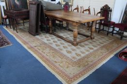 A Persian carpet, with field of one hundred and forty seven pear shaped floral motifs, on a beige