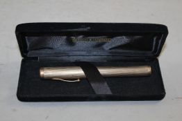 A Watermans 9ct gold engine turned fountain pen, 5in.