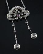 An early 20th century continental silver, ruby, sapphire and diamond set drop pendant necklace, of