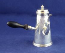 A late Victorian silver chocolate pot, of tapering form, with panelled spout and turned finial,