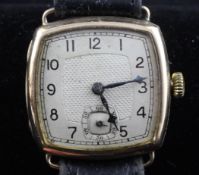 A gentleman`s 1940`s Swiss 9ct gold manual wind wrist watch, with cushion shaped Arabic dial and