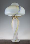 A Sabino Art glass lamp base and shade, with blue, yellow and red swirled decoration to the