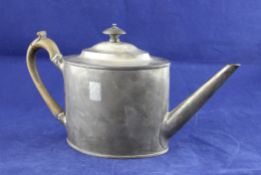 A George III plain silver oval teapot, with reeded borders and turned wooden finial, Alexander