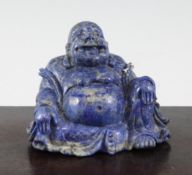 A Chinese lapis lazuli seated figure of Budai, 4.25in. Starting Price: £144