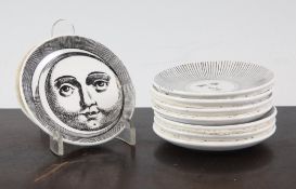 A set of eight Piero Fornasetti `sun and moon` coasters, each transfer printed in black, the bases
