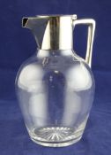 An Edwardian silver mounted plain glass claret jug, by Hukin & Heath, of baluster form, with angular