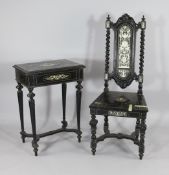 An Italian Renaissance style ebony and ivory inlaid work table, on tapered fluted legs and shaped