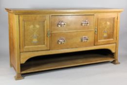 An Arts & Crafts Liberty oak sideboard, with two central drawers and a pair of cupboard doors,