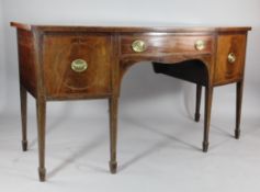 A George III mahogany and satinwood banded bow front sideboard, with central drawer flanked by two