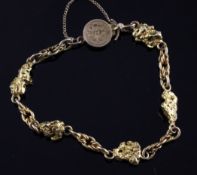 A gold nugget and chain link bracelet, with disc shaped clasp, gross 29.7 grams. Starting Price: £