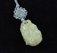 A Chinese greenish-yellow jade carving, late 19th / early 20th century, modelled as a gourd carved