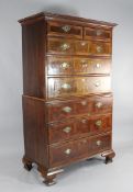 A 18th century oak and walnut chest on chest, with brass handles, on ogee bracket feet, W.3ft 5in.