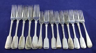 A set of six Edwardian silver fiddle pattern dessert forks and five table forks, with engraved