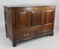 An 18th century oak mule chest, with three fielded panels over two base drawers, on shaped bracket