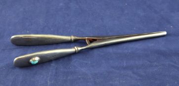 A pair of George V silver handled steel glove stretchers, by Liberty & Co, each handle inset with