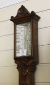 A Victorian oak cased stick barometer, with painted glass scales signed Rowell & Harris, Oxford, 3ft