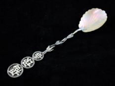 An early 20th century Chinese silver and mother of pearl spoon, with foliate stem with three